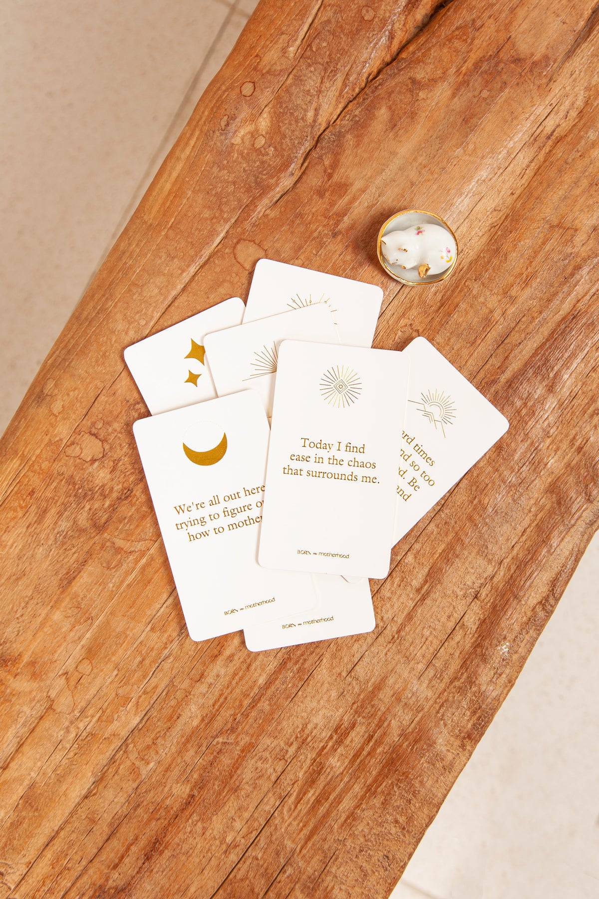 Gold-foiled badass motherhood cards with bold language